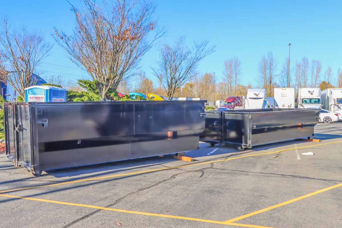 Professional dumpster rental service with roll-off container on residential driveway in Bothell West